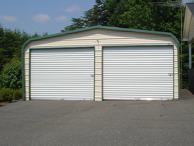 standard-two-car-metal-garage Standard two car metal garage with two roll-up garage doors.